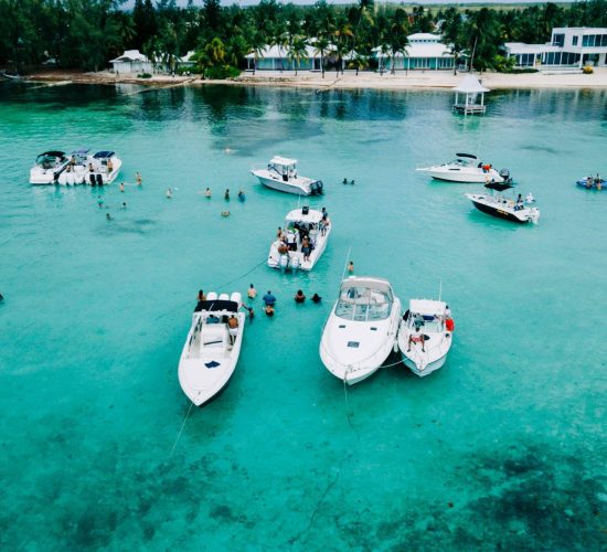 Boats moored in the shallows off Grand Cayman, one of the Caribbean's largest British expat communities.