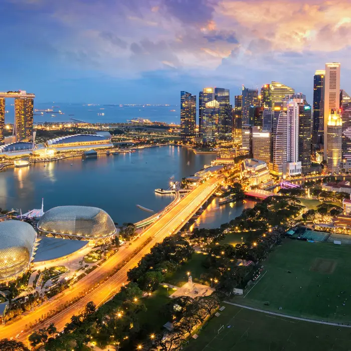 The Singapore skyline and Marina Bay at dusk, seen from above
